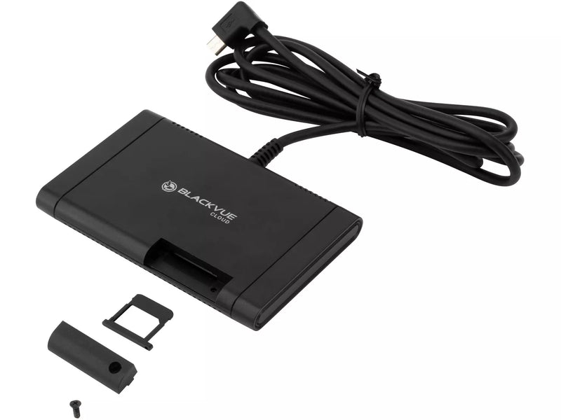 Black electronic device with cable and small components on a white background