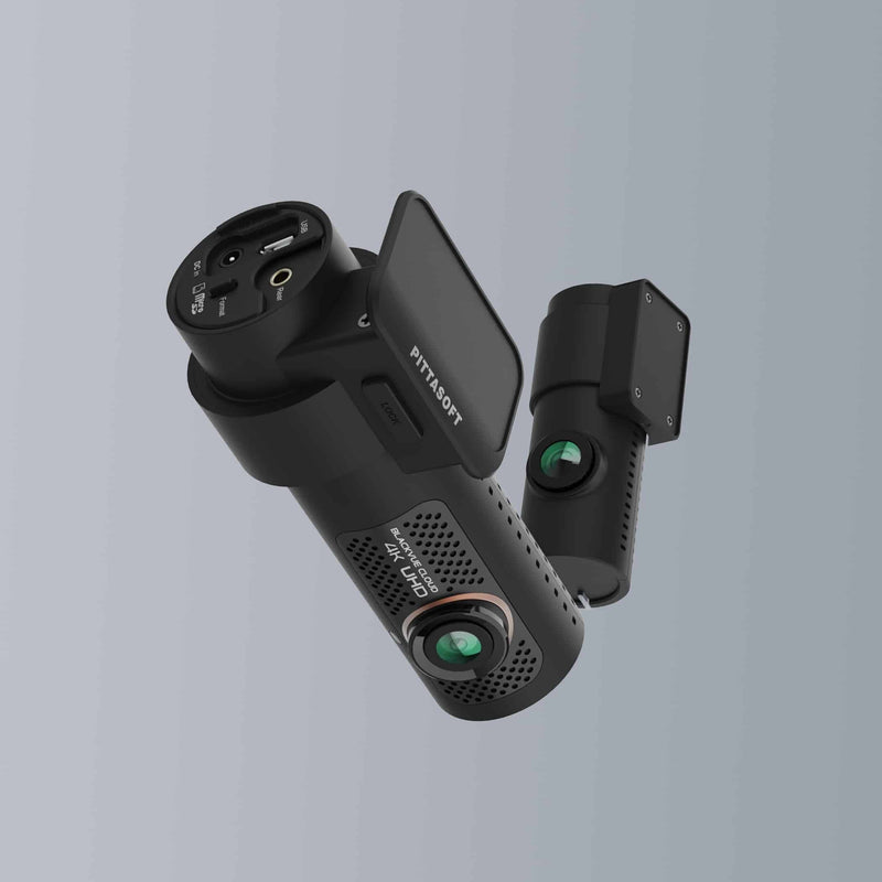 Black car dashboard camera on a gray background